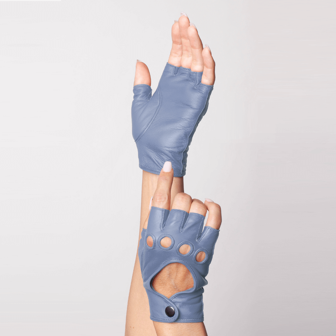 Top view of Patricia Field's City Sky Blue Italian leather fingerless driving gloves from Emily in Paris with snap button closure, shown in hand modeling pose.