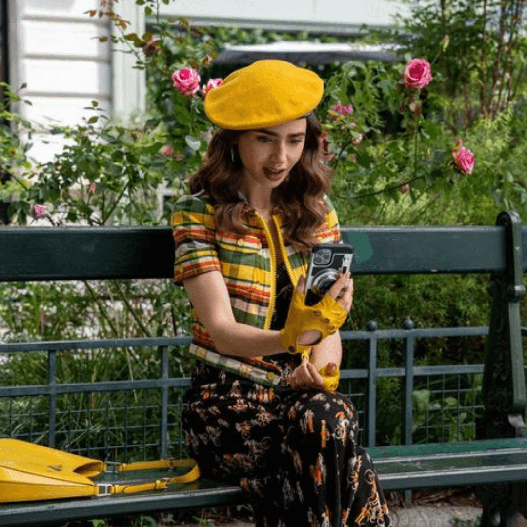 Lily Collins wearing Patricia Field’s Taxi Yellow Italian leather fingerless driving gloves with snap button closure from Emily in Paris