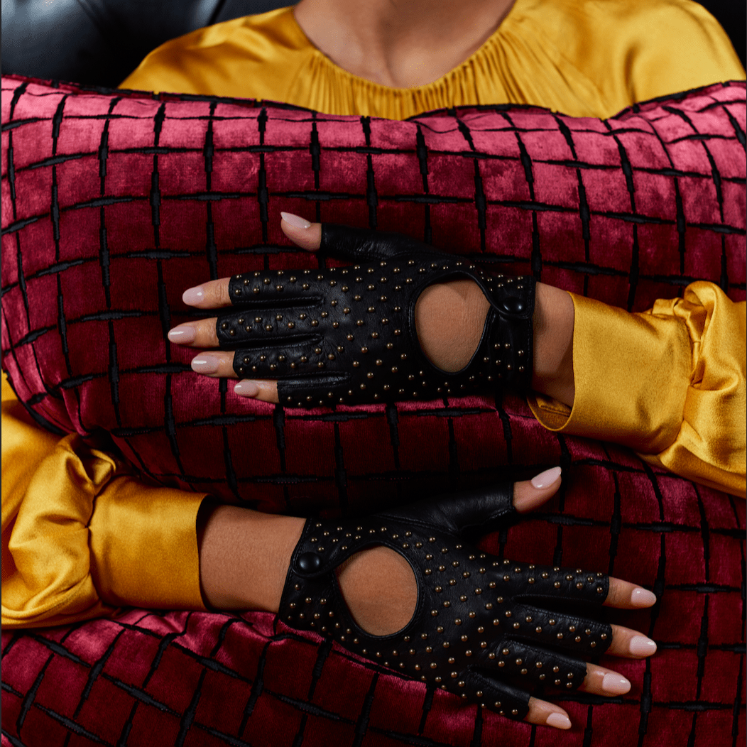 Black studded fingerless gloves with yellow silk sleeves and red velvet