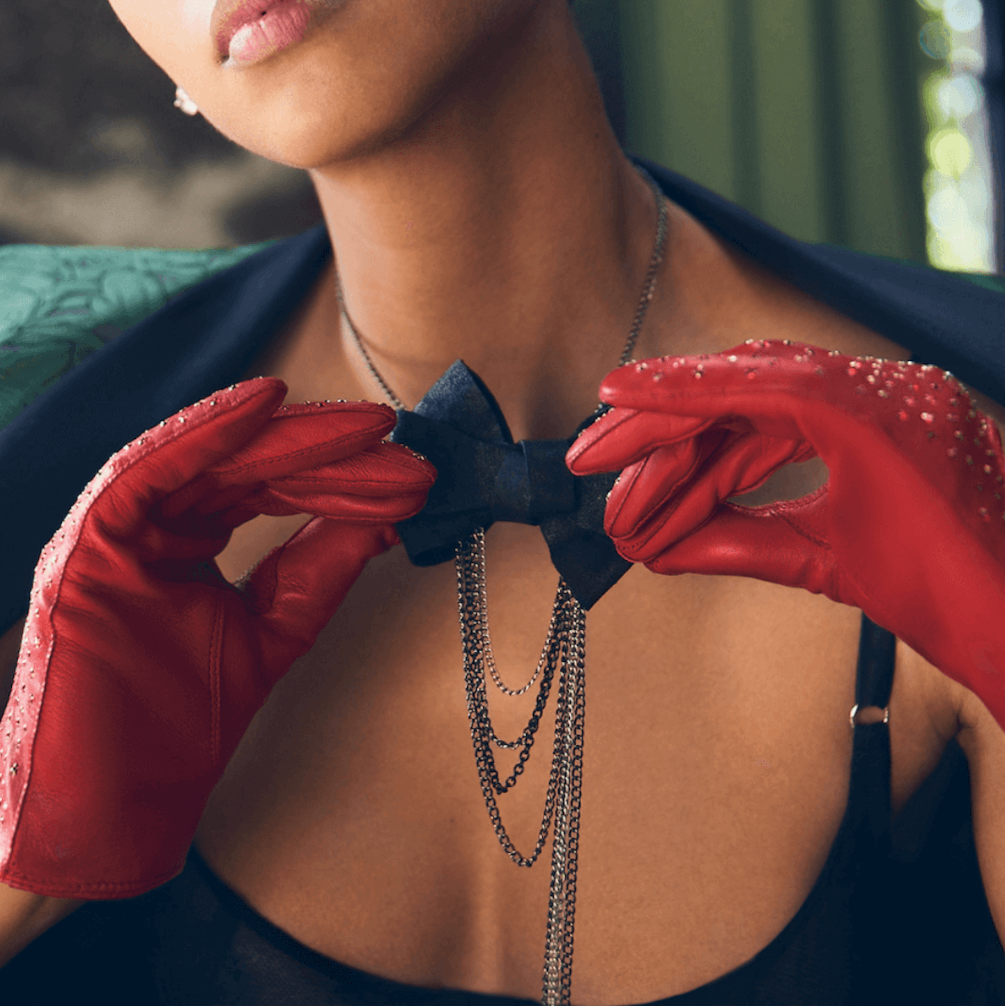 red leather driving gloves with crystal model hands on black bow