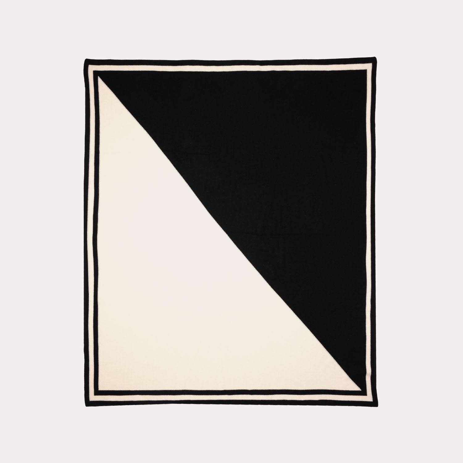 Black and white cashmere blanket by Seymoure Luxury Group.