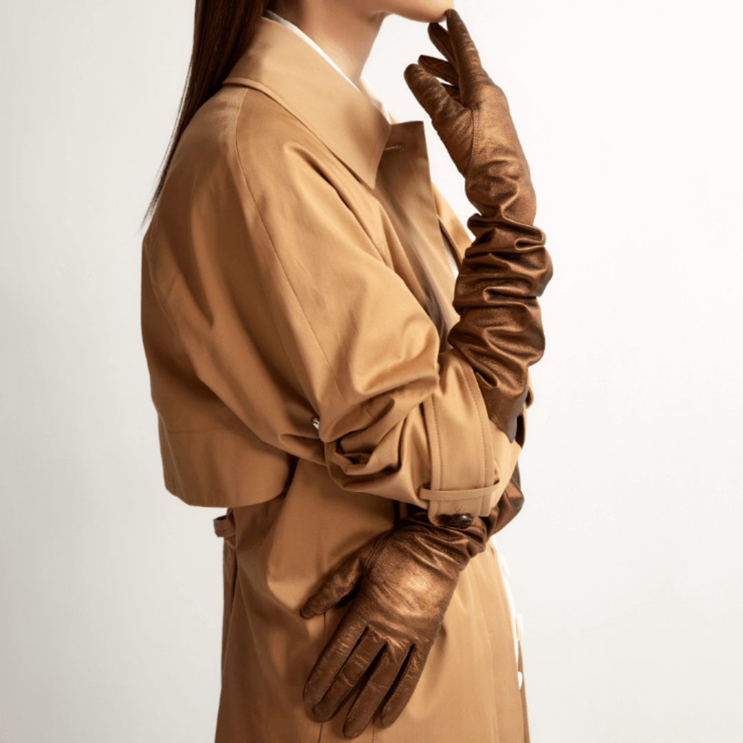 Camel trench coat with metallic brown leather gloves, minimal fashion