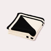 Black and white cashmere blanket by Seymoure Luxury Group.