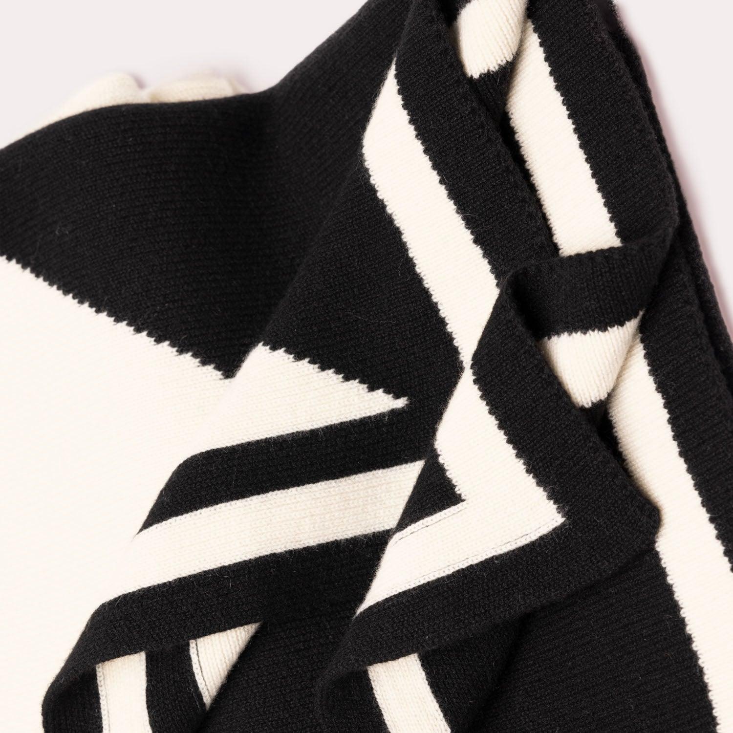 Black and white cashmere blanket by Seymoure Luxury Group.